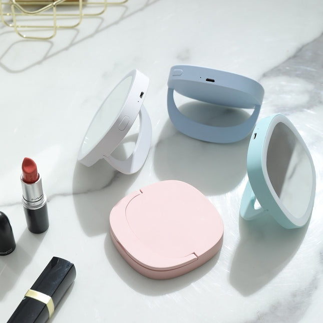 Portable makeup mirror with lights

