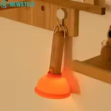 Quirky plunger desk lamp


