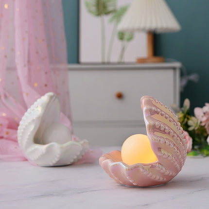 Shell lamp with embedded pearl

